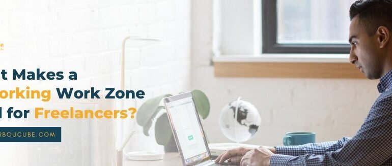 Freelancers working productively in a coworking work zone environment
